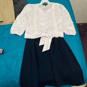White blouse and navy blue skirt in my closet
